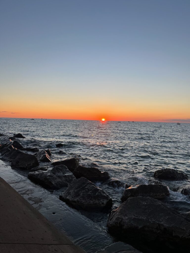 Sunset on Lake Michigan with Rock Walkway to Lighthouse